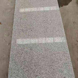 七台河芝麻白光面毛板